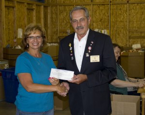 Pictured with Executive Director, Lucinda Schaefer, is Macon Elks Lodge #999 Exalted Ruler, Cecil Arnett, making a donation from the Elks Lodge.